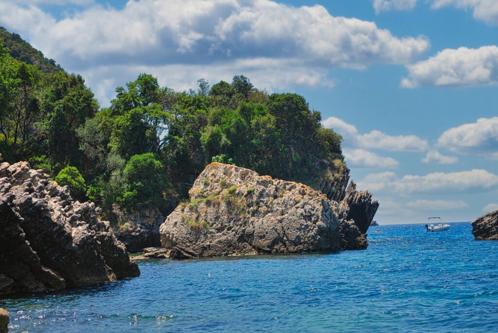 the rocky nice and picturesque beach of the Liapades Bay in the Corfu island
